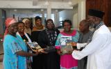 Pastor James Wuye and Imam Muhammad Ashafa present DVDs and the Resource Guide of An African Answer to the organizing teams from the Minda and Eleka Trusts.